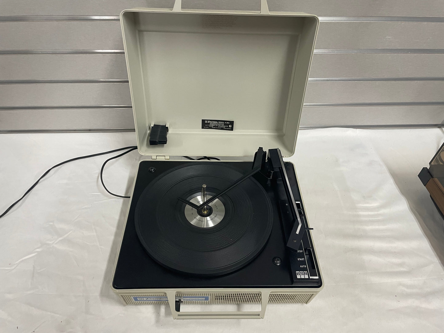 Emerson Automatic Record Player Swingmate. ModelA-25A. Household Phono. Comes in plastic case. Handle to carry.