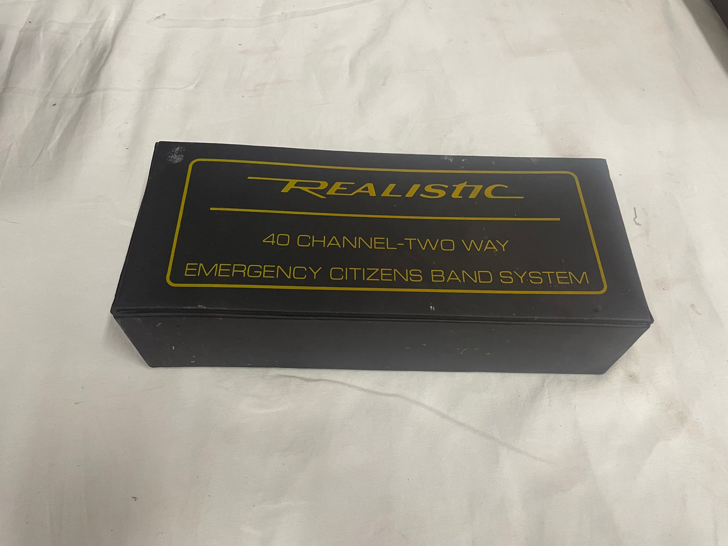 Realistic 40 Channel Two Way Emergency Citizens Band System. Yellow smaller system. Comes with all parts. Barely used. Comes with manual and operating instructions.