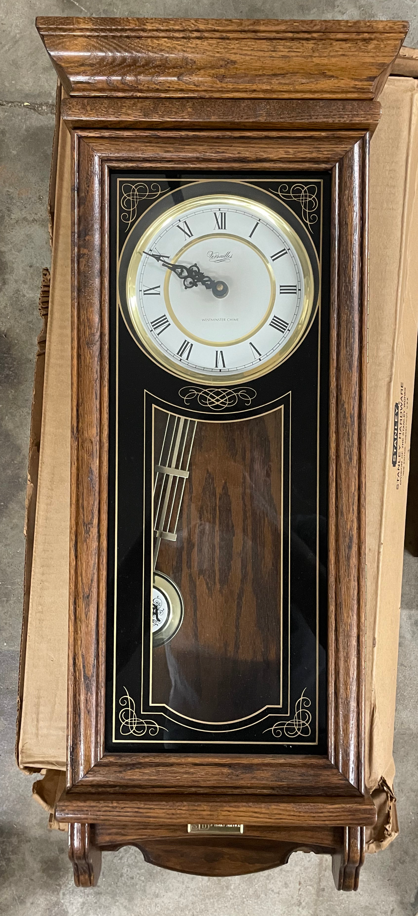 Versailles Wall Clock. Wooden clock. Comes with all parts. 31x13inches. Opens up.