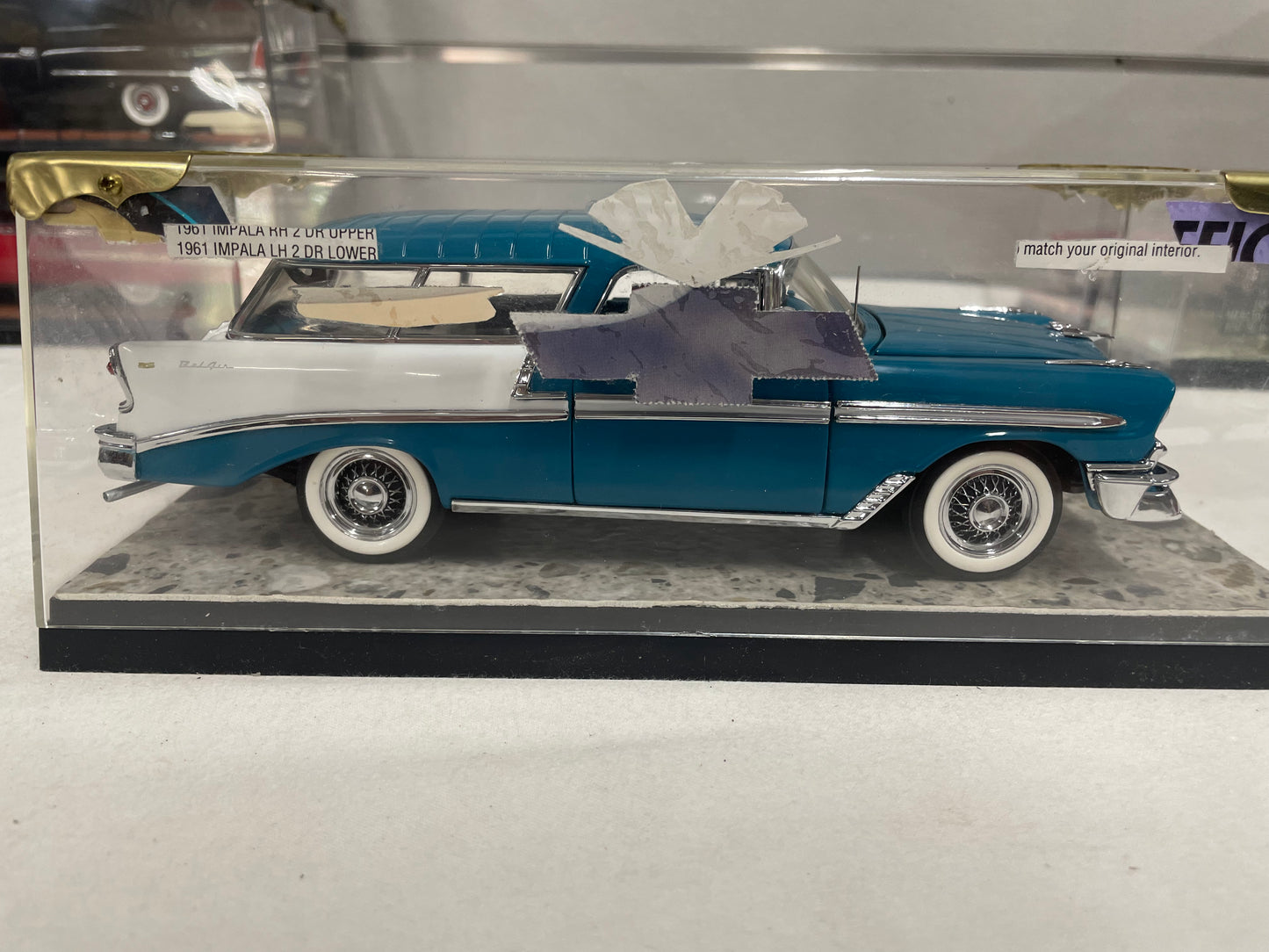 1956 Chevrolet Nomad with display case.