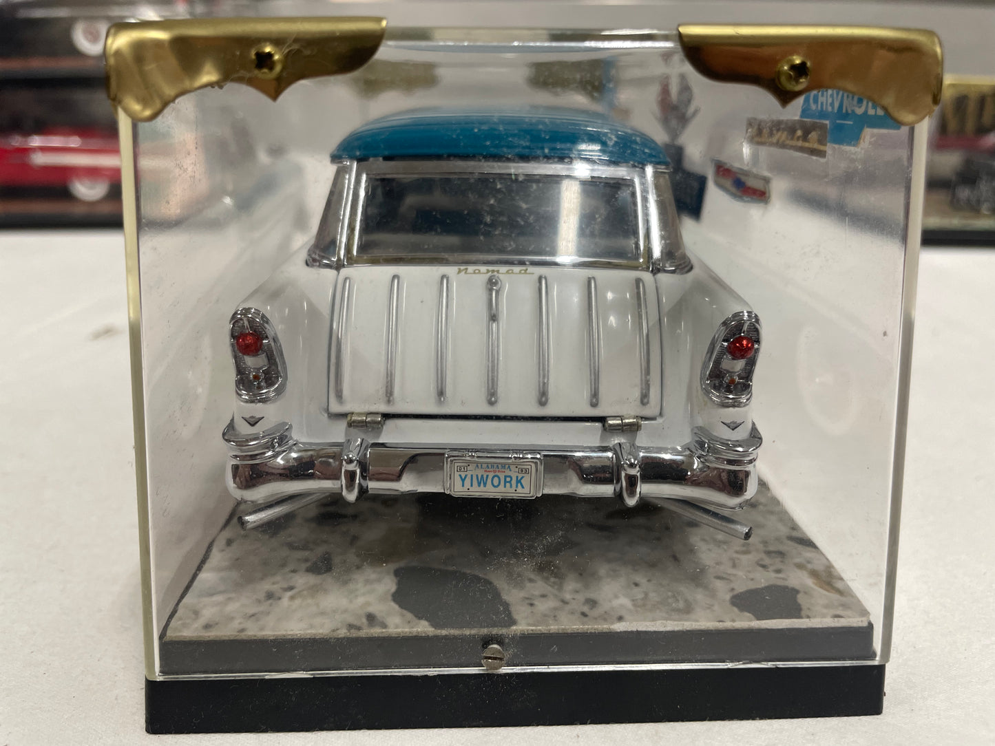 1956 Chevrolet Nomad with display case.