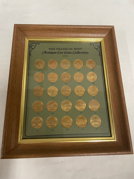 The Franklin Mint Antique Car Coin Collection 10x12in. 1901-1925. Wooden frame included.