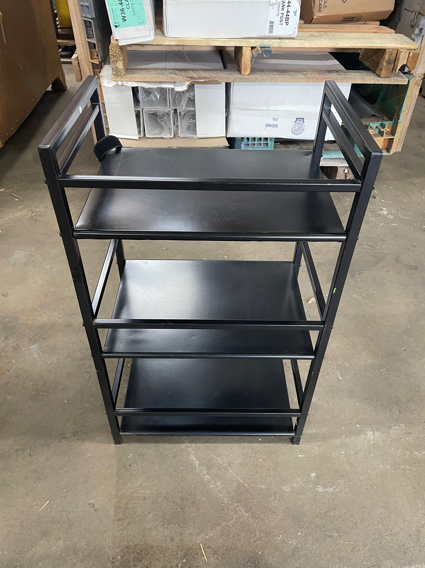 Black Multipurpose Shelf. Metal. 3 shelves. 28inches tall, 17in wide, 11.5in long.