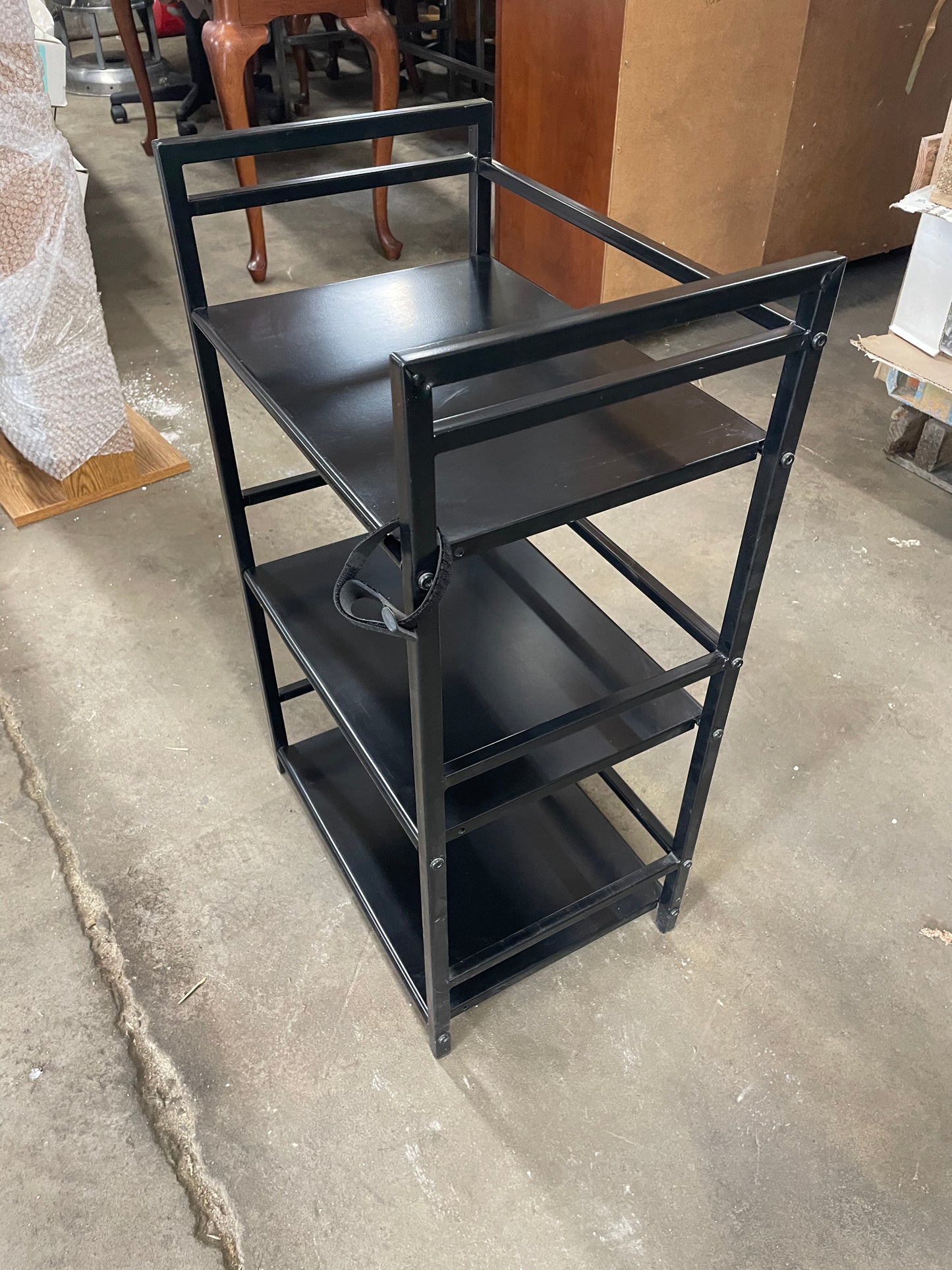 Black Multipurpose Shelf. Metal. 3 shelves. 28inches tall, 17in wide, 11.5in long.