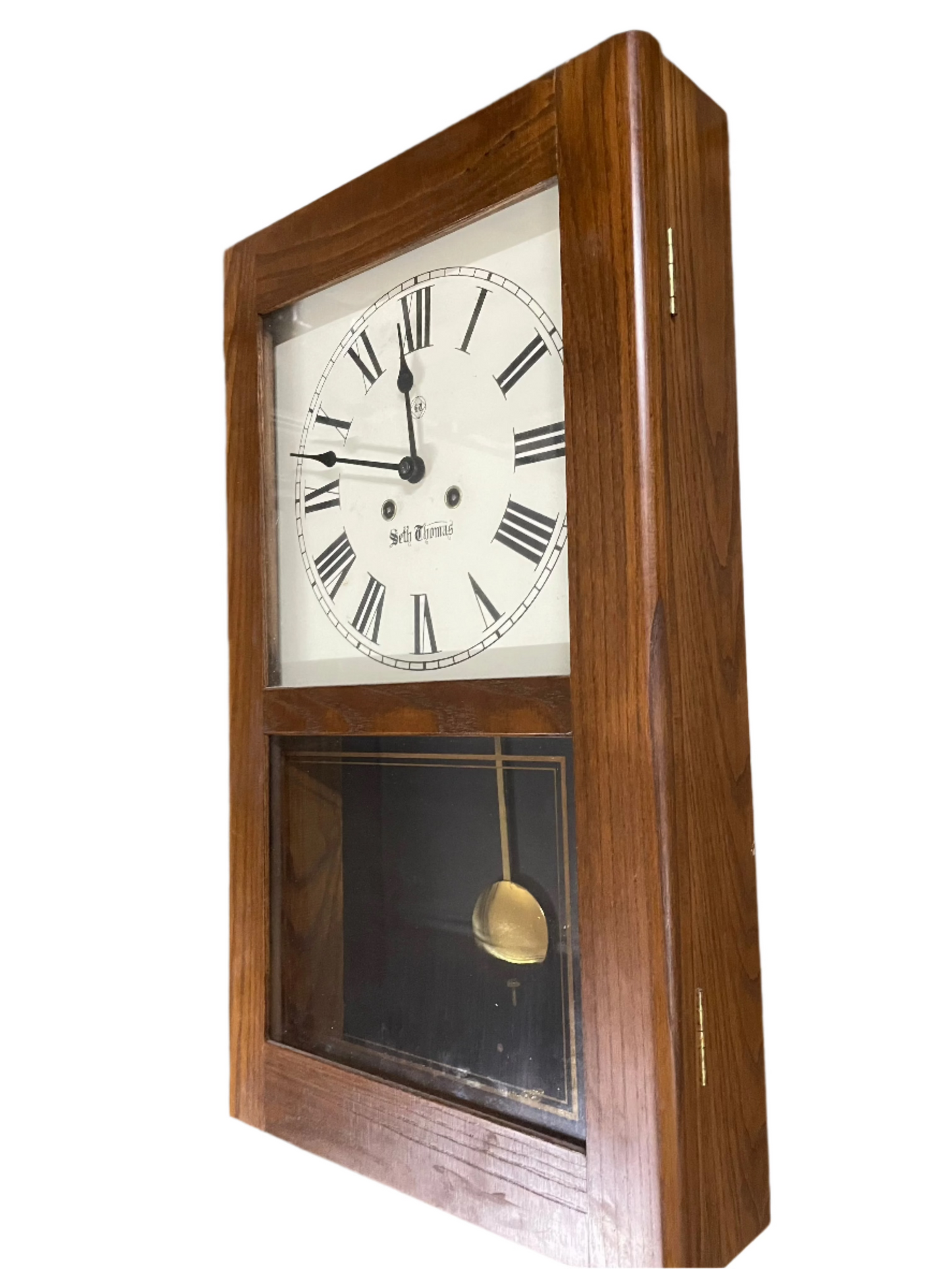 Seth Thomas Wooden Wall Clock. 21.5x12.5inches. Opens up with key.