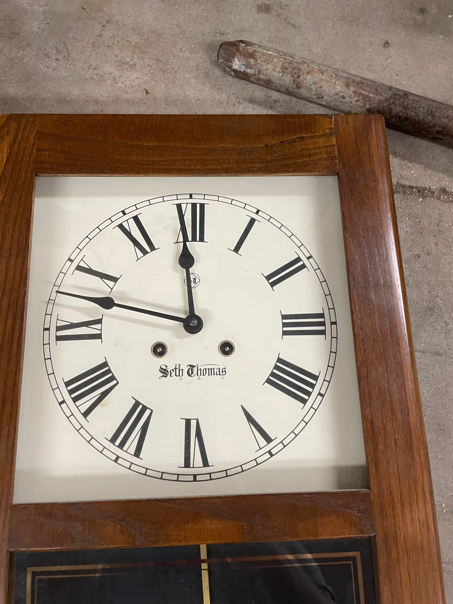 Seth Thomas Wooden Wall Clock. 21.5x12.5inches. Opens up with key.