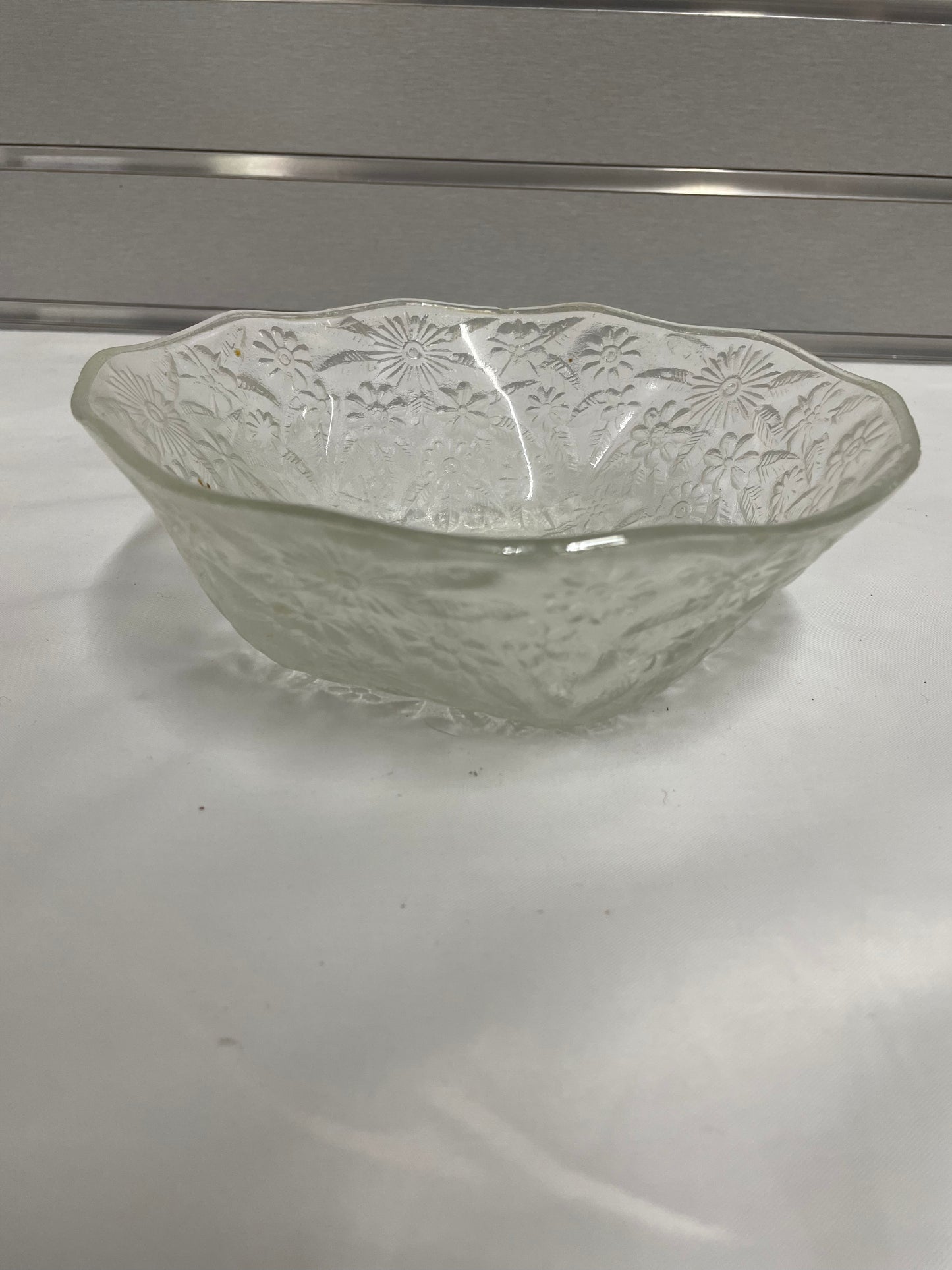 Small Detailed Glass Bowl. 7.5”x2.5”. Flower details.