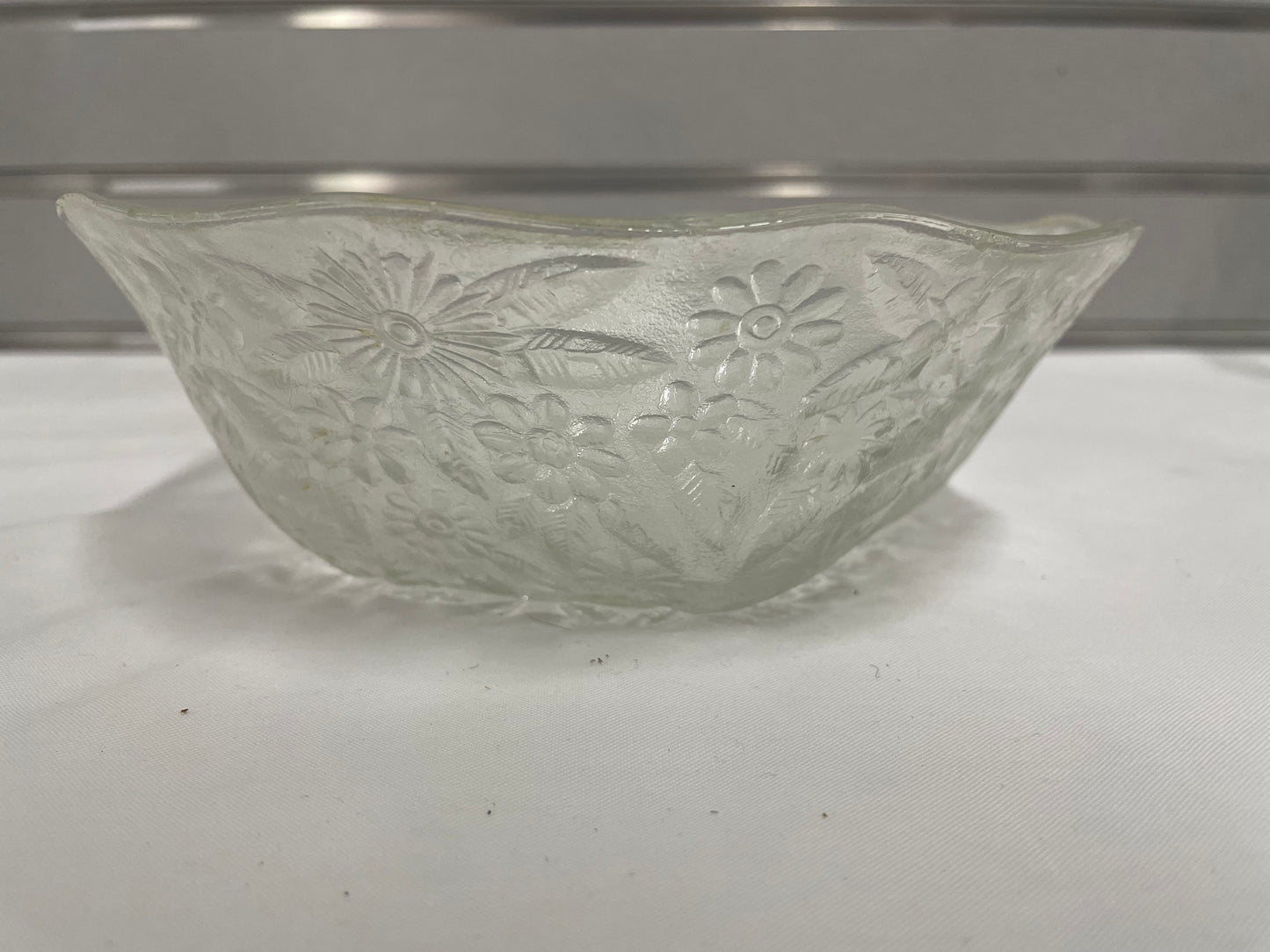 Small Detailed Glass Bowl. 7.5”x2.5”. Flower details.