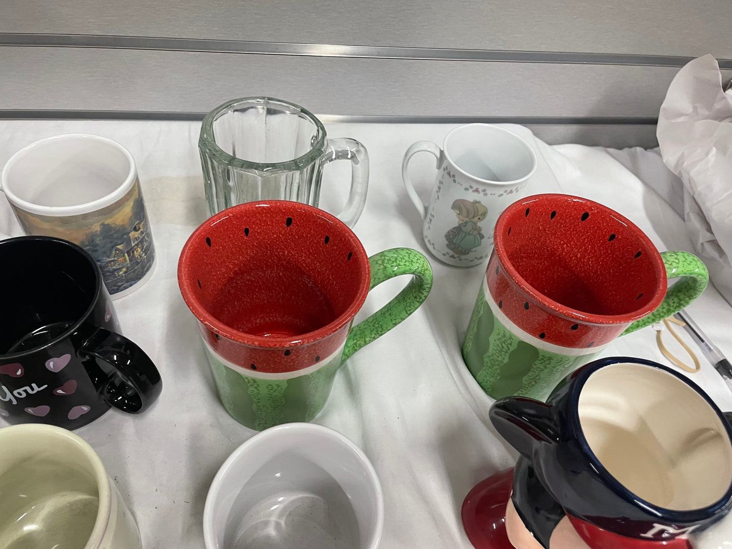 Collection of Miscellaneous Coffee Mugs. Come in all shapes, sizes and colors. 24 ceramic coffee mugs included.