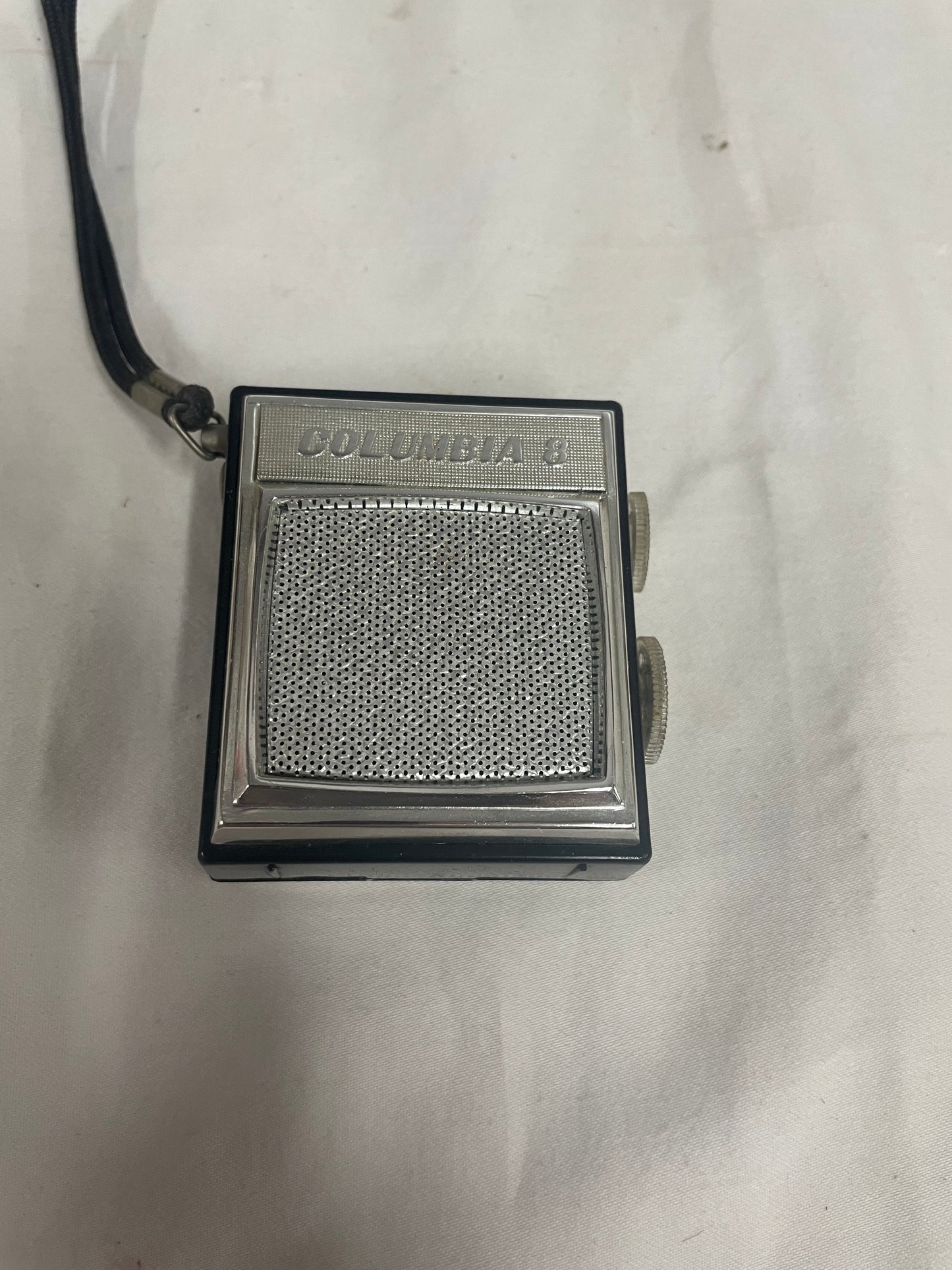 Columbia 8 Pocket transistor radio. JT-602. Black radio. Very small. Comes with leather case.