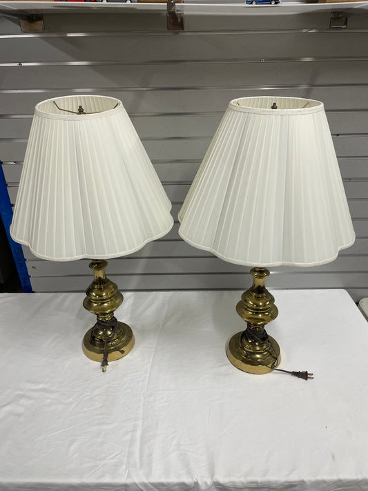 Two Gold Lamps with Lamp Shades. 30” tall and the shade is 18” wide. Lamp shade is white.