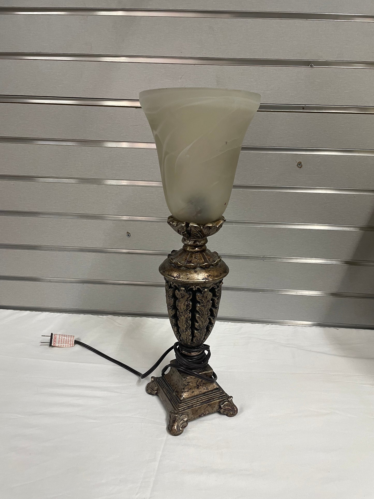 Bronze Ceramic Lamp with Whote glass lamp shade. 18.5” tall and the glass shade is 7” wide.