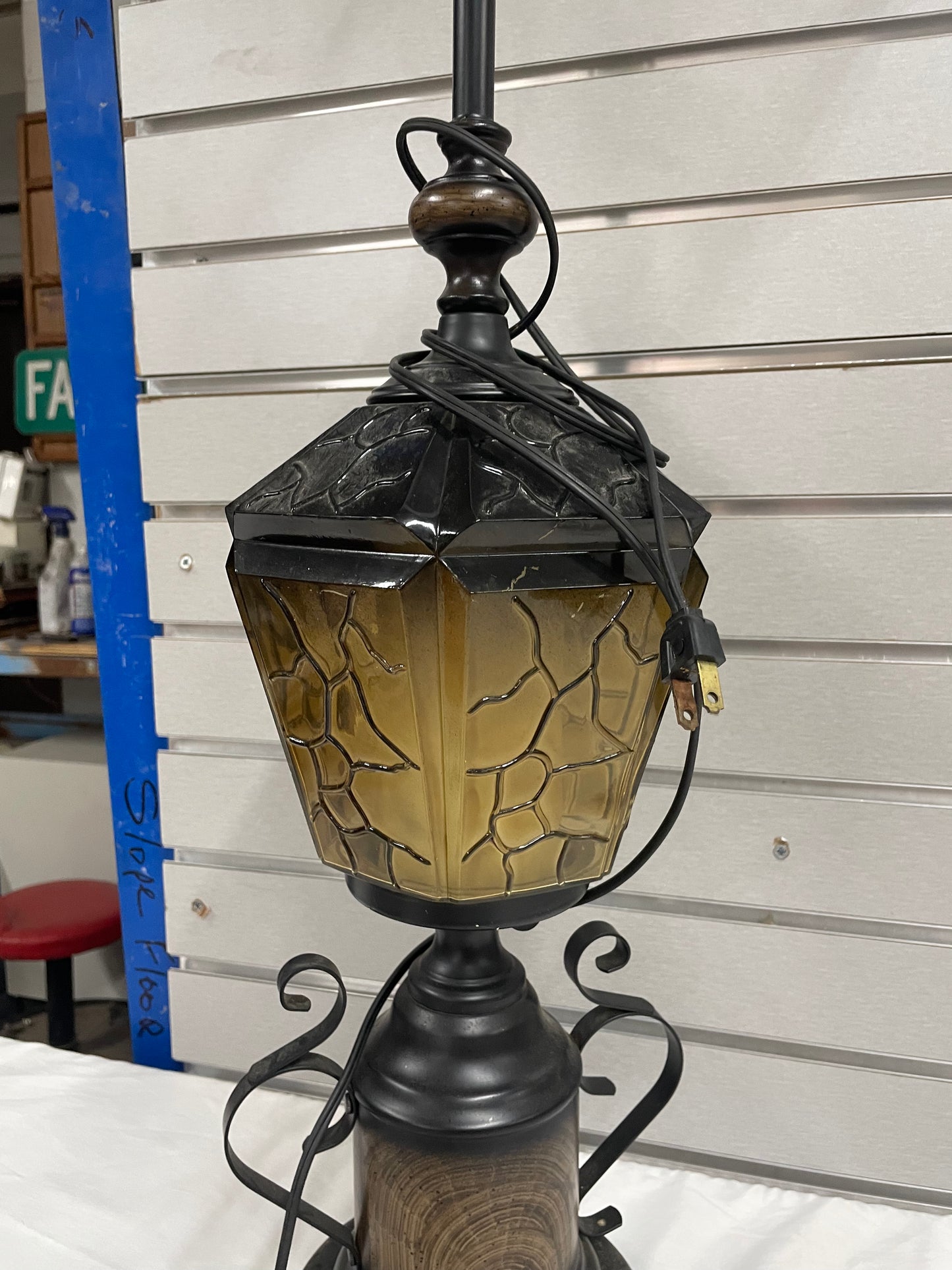 Black Metal Lantern Design Lamp. Glass Lamps is 35” tall and 8” wide.