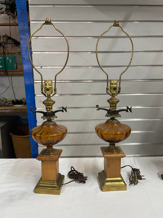 Hold Wooden Glass Lamp Set. Lantern design in the middle made of glass. Weather Vane attached to middle of lamps.