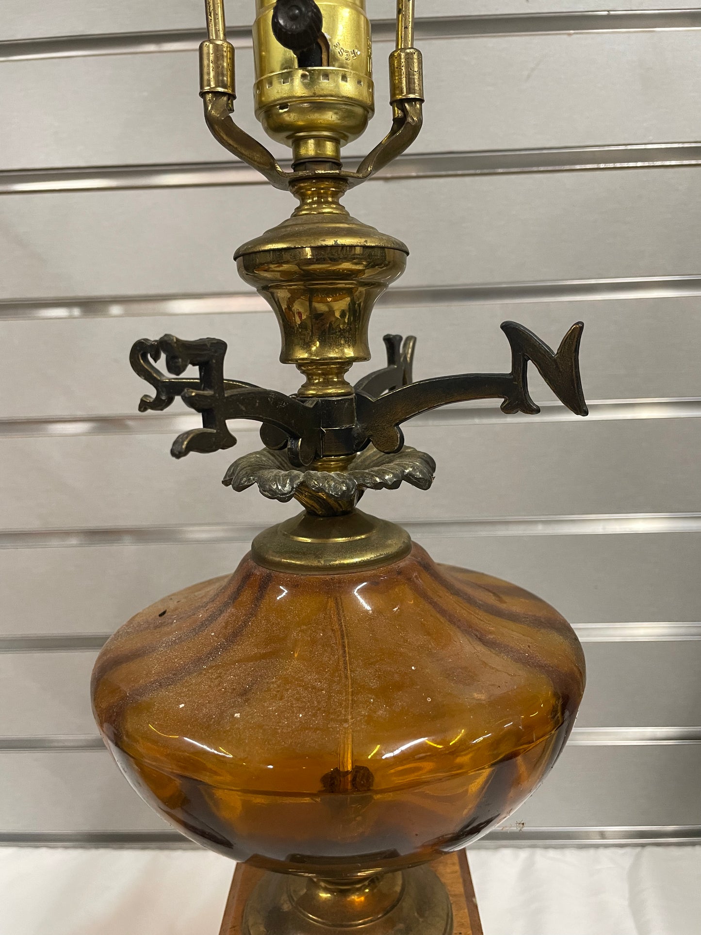 Hold Wooden Glass Lamp Set. Lantern design in the middle made of glass. Weather Vane attached to middle of lamps.