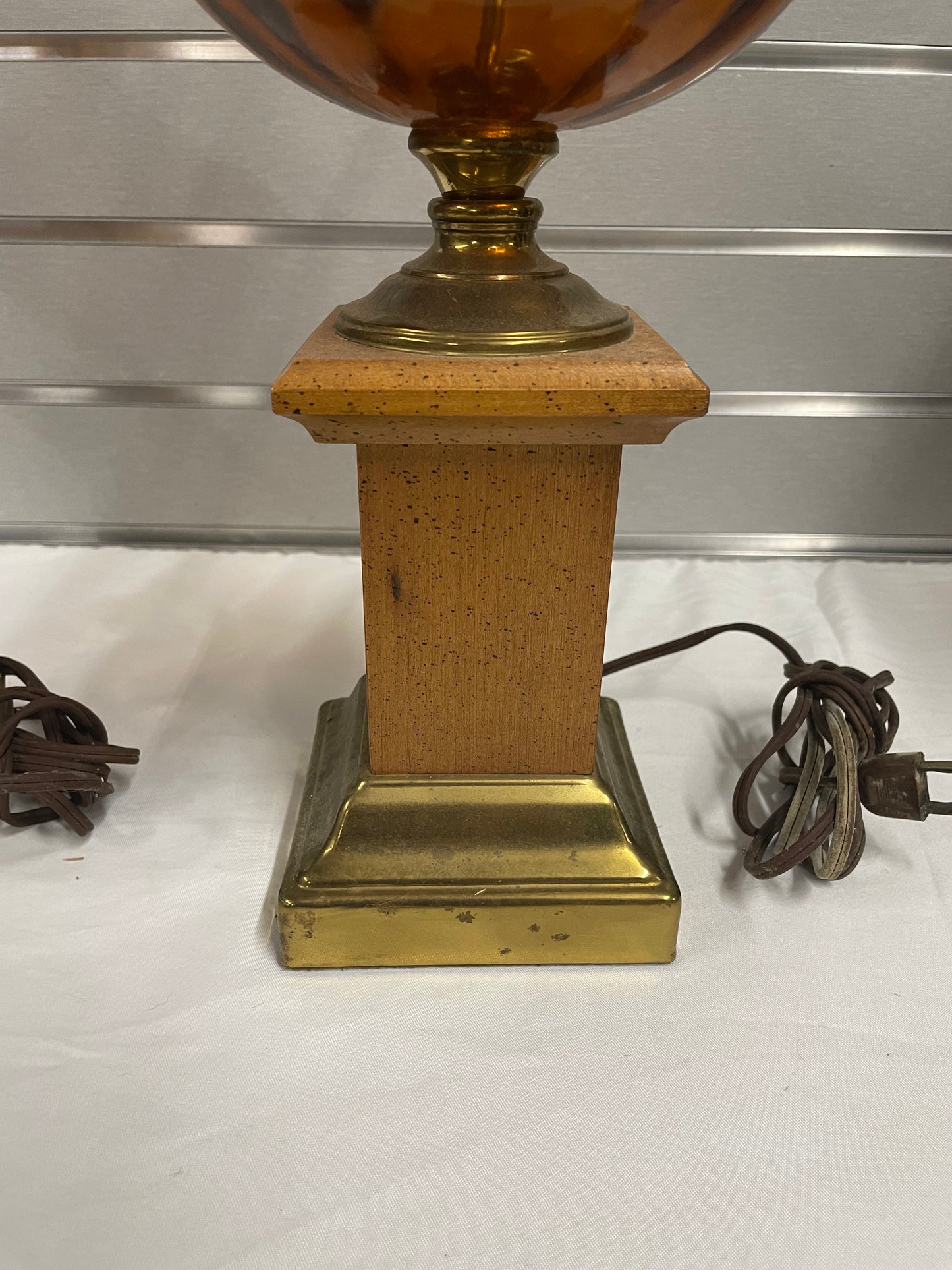 Hold Wooden Glass Lamp Set. Lantern design in the middle made of glass. Weather Vane attached to middle of lamps.