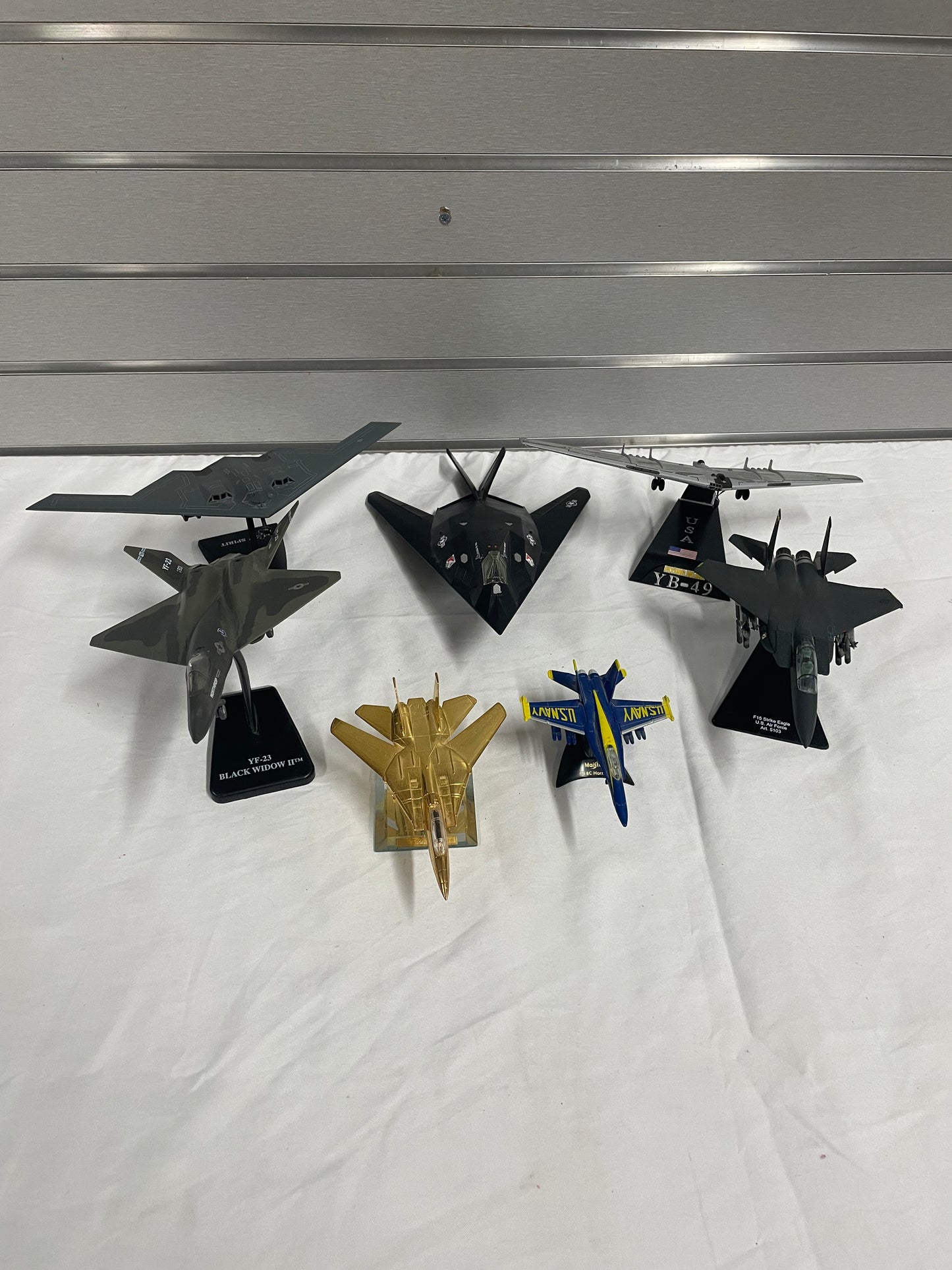 Lot of winged fighter jets / planes. 7 planes in total. All are plastic models. B-2 Spirit. YB-49. YF-23 Black Widow 2. F-14A Tomcat. F-18C Hornet. F15 Strike Eagle. 37 TFW. 4-10” planes.