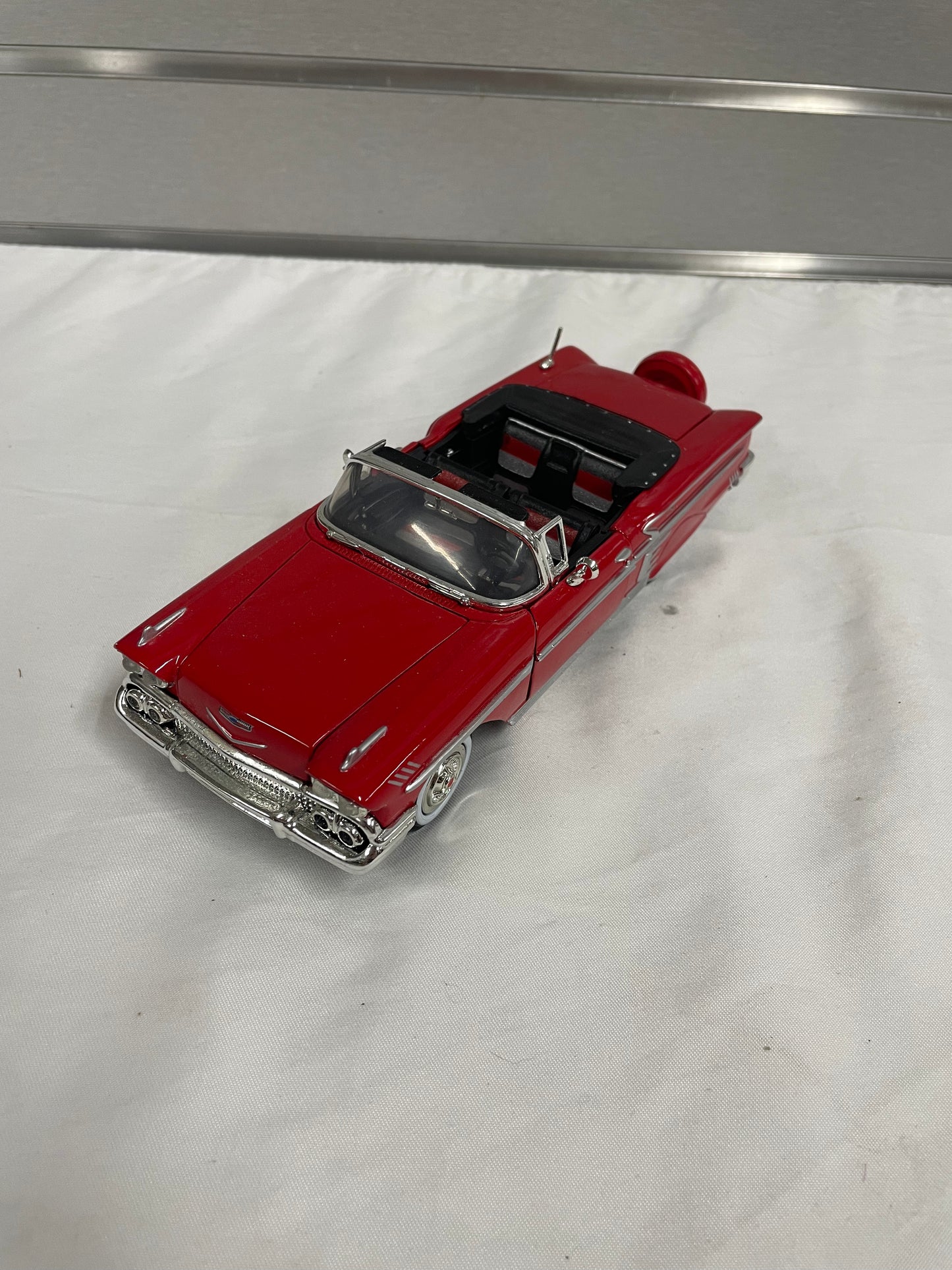 1958 Chevrolet Impala Diecast Model Car. 1:25 Scale car. Metal car. Impala is red and a convertible