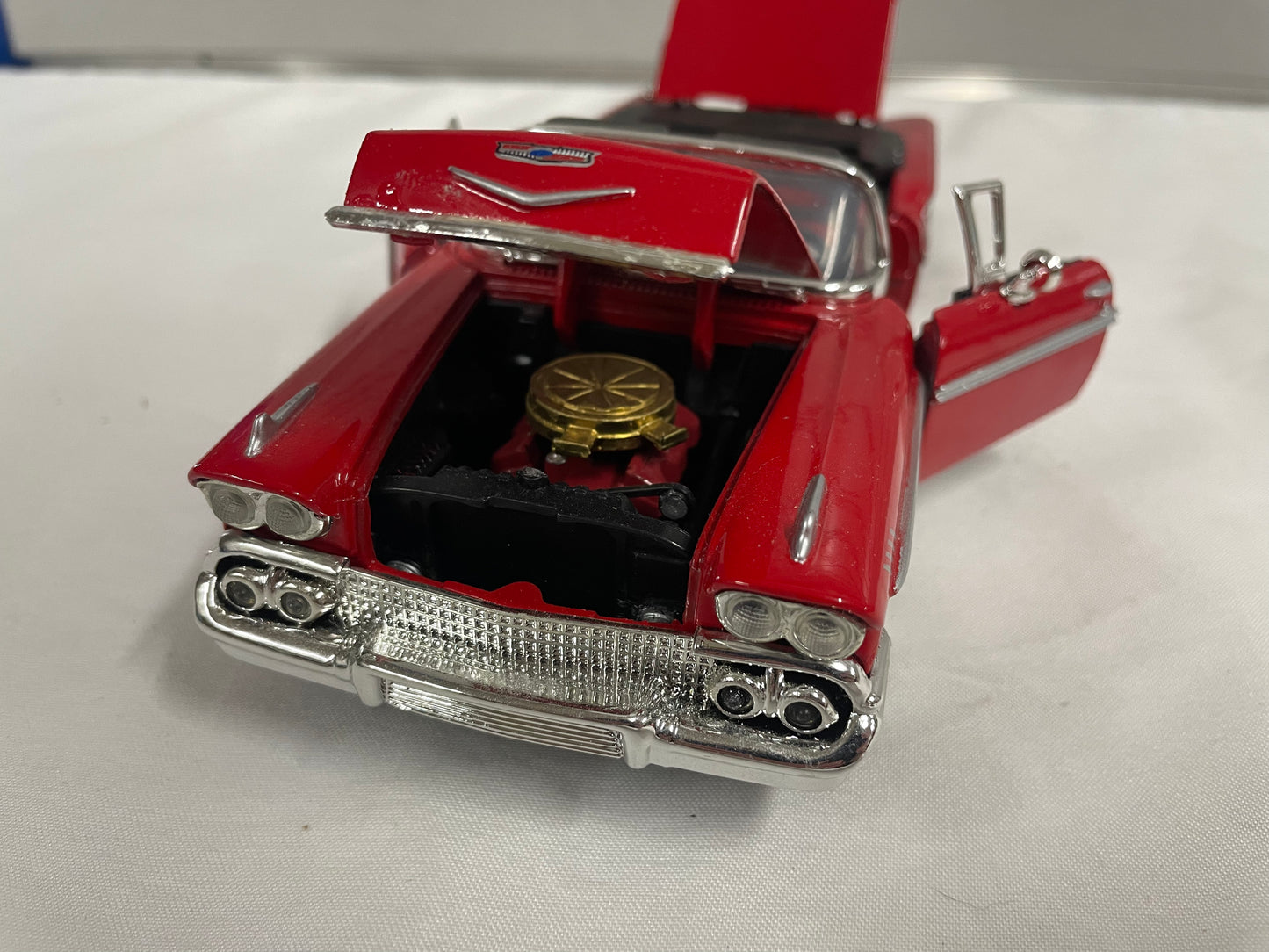 1958 Chevrolet Impala Diecast Model Car. 1:25 Scale car. Metal car. Impala is red and a convertible