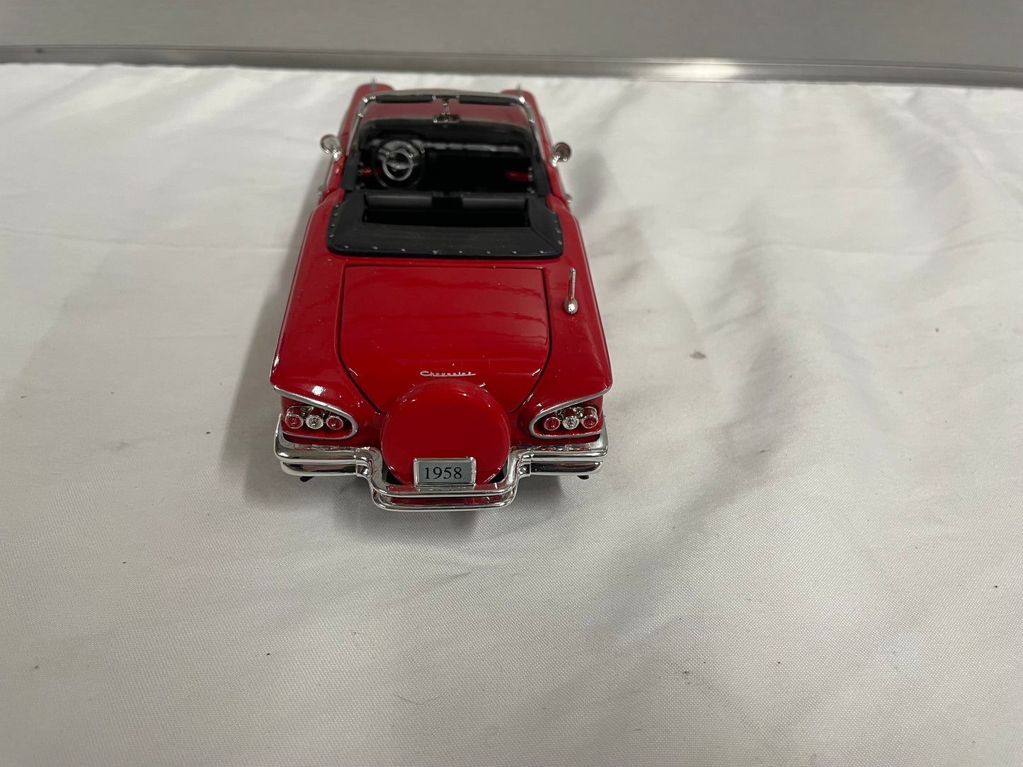 1958 Chevrolet Impala Diecast Model Car. 1:25 Scale car. Metal car. Impala is red and a convertible