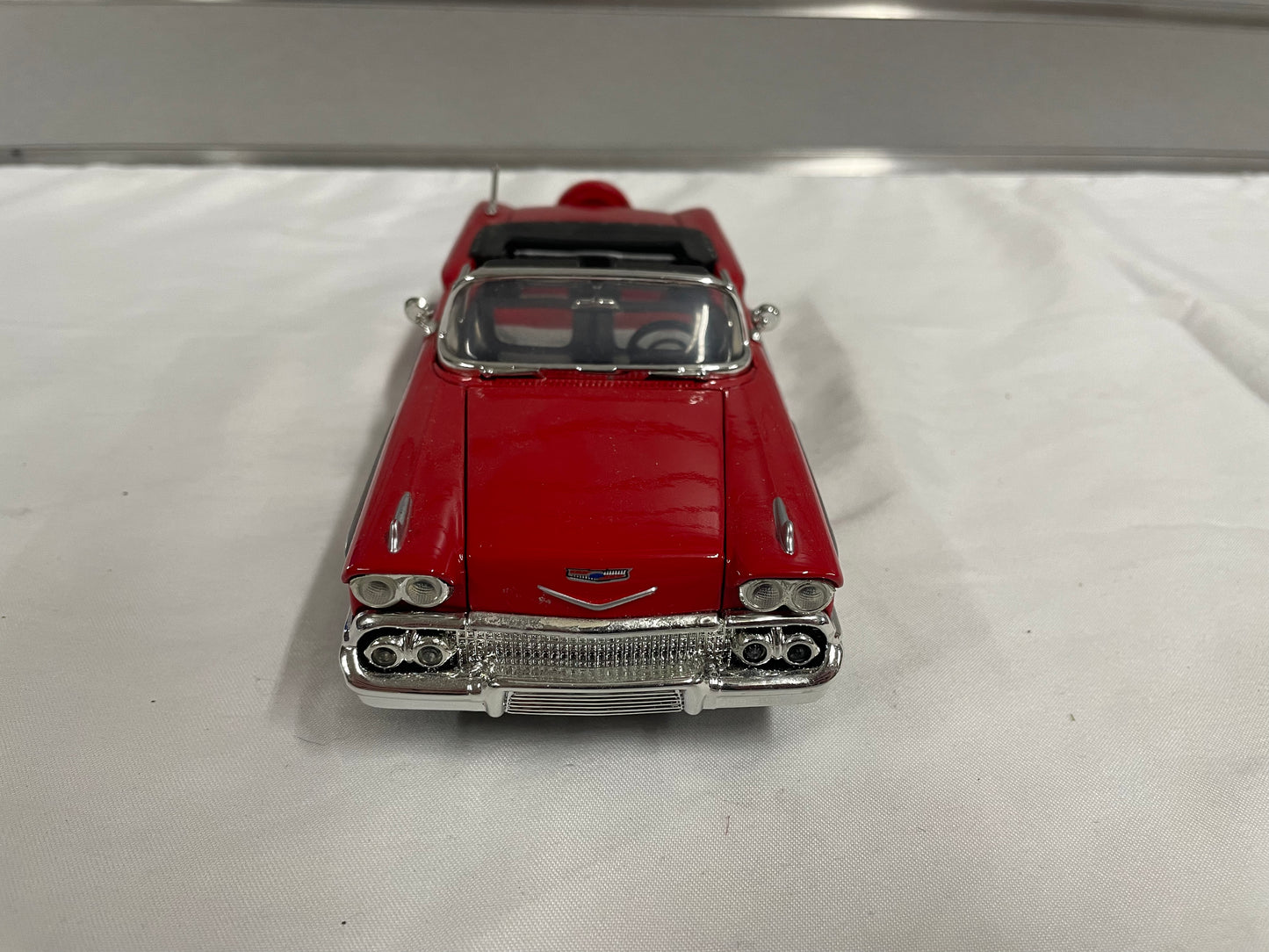 1958 Chevrolet Impala Diecast Model Car. 1:25 Scale car. Metal car. Impala is red and a convertible