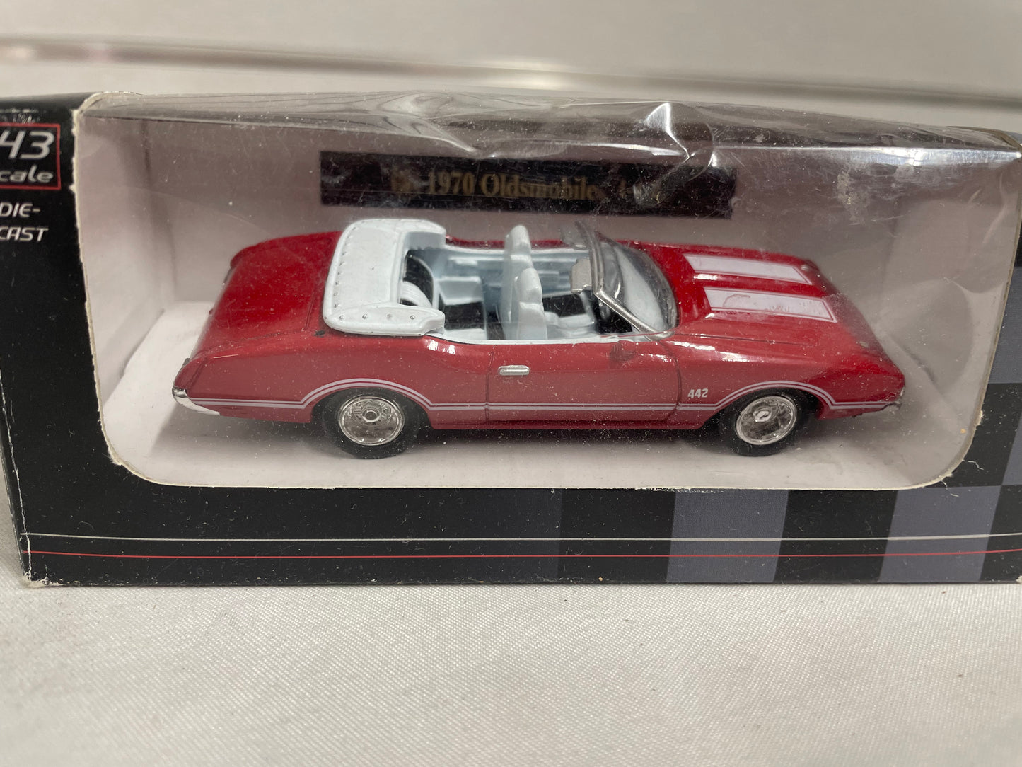 City Cruiser 1970 Oldsmobile 4-4-2. DieCast model car. 1:43 scale. In original box. Red convertible